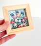 Little houses on a fabric hill, with flowers, in small wooden frame - Image 3