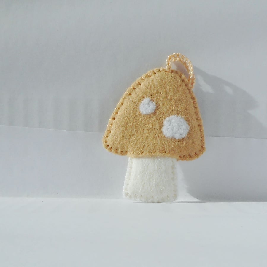 Soft beige toadstool hanging decoration, needlefelted and handstitched