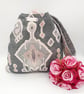 Reversible grey and patterned knot bag.  - Image 2