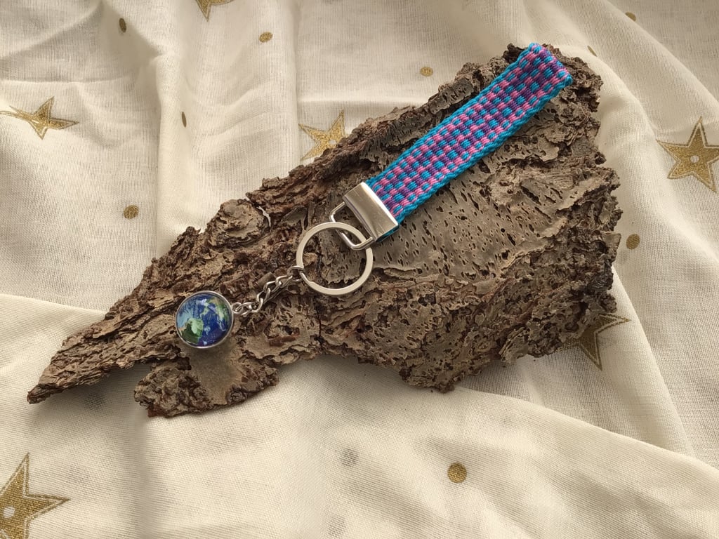 Hand woven key fob with attached Earth planet embellishment orb