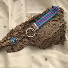 Hand woven key fob with attached Earth planet embellishment orb