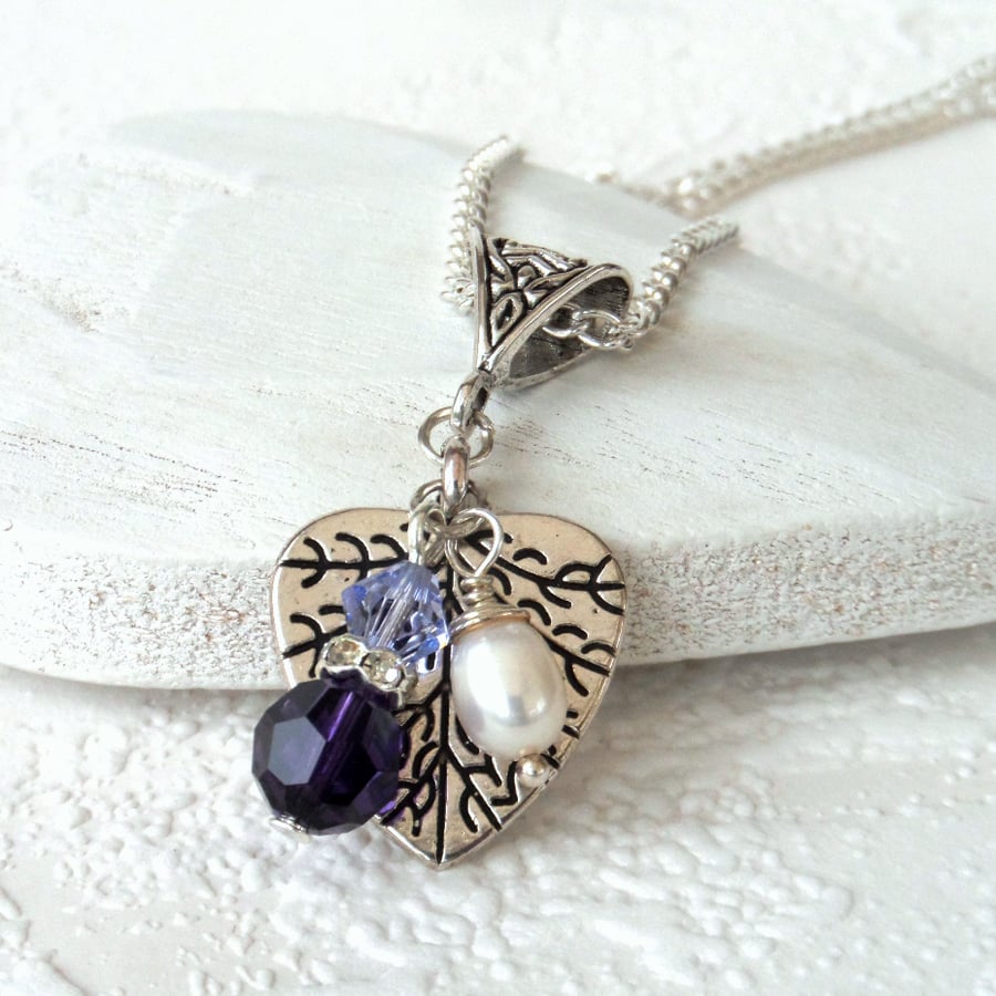 Charm necklace with pearl and purple crystal from Swarovski®