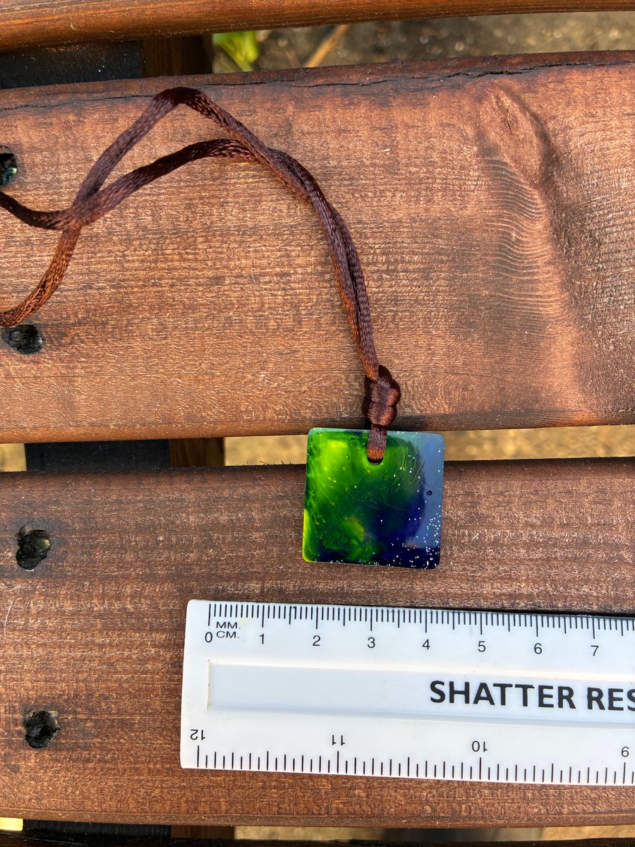Small square resin seascape pendant swirling ocean colours of green and blue