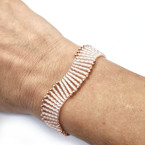 Peach and rose gold twisted bugle bead wavy bracelet