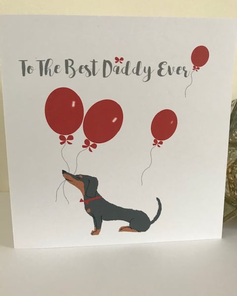Best Daddy Ever Greeting Card featuring a Dachshund with red balloons
