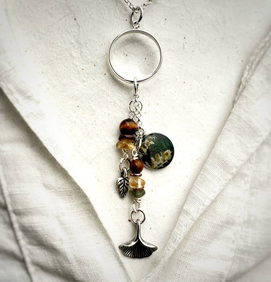 Silver Plated Charm Pendant Necklace featuring a fern charm. 