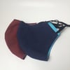 Large size, double layered face masks in plain fabrics.