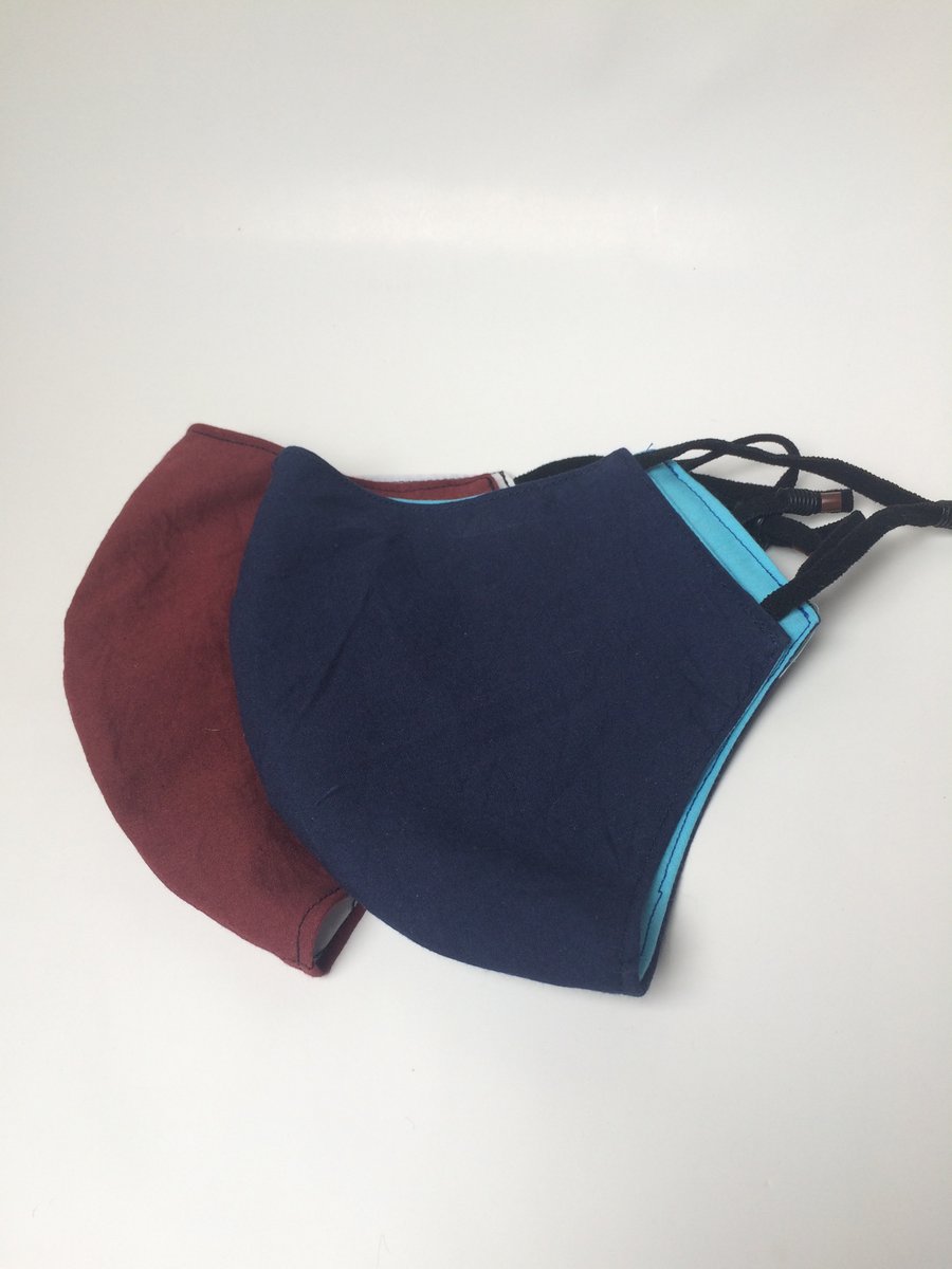 Large size, double layered face masks in plain fabrics.