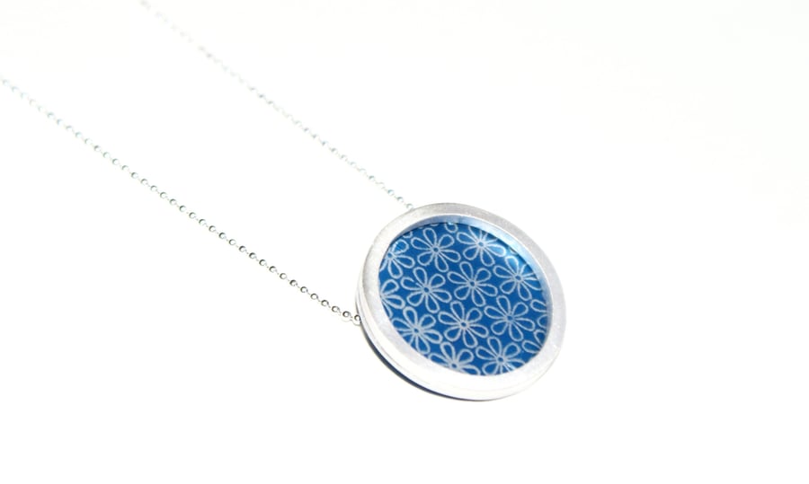 Silver and blue circle necklace - flower pattern