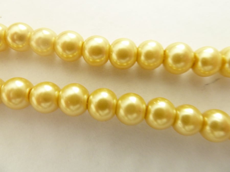 100 gold glass pearls