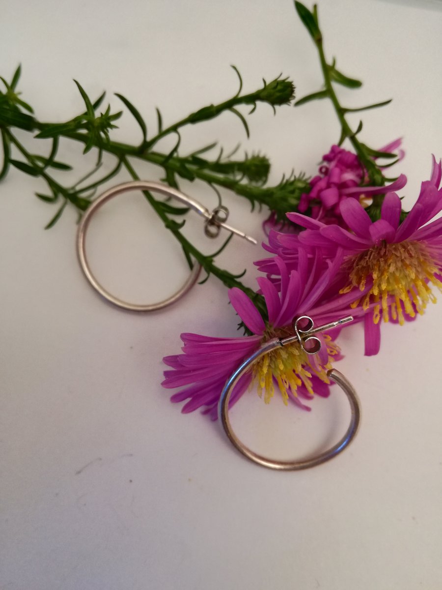 Satin finish sterling silver circular stud earrings