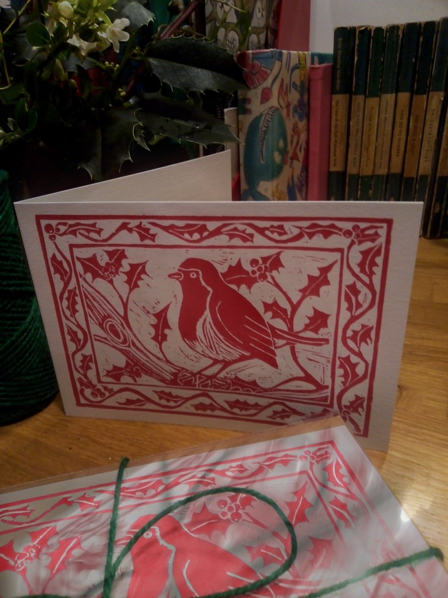 Pack of five robin and holly greetings cards based on an original linoprint