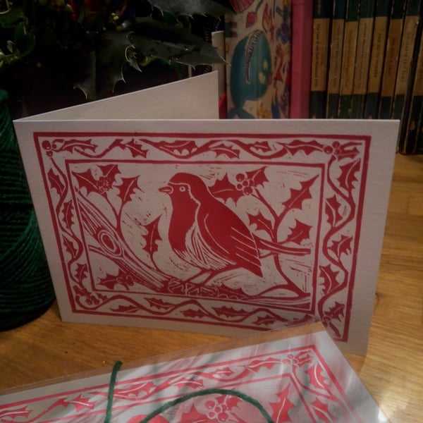 Pack of five robin and holly greetings cards based on an original linoprint