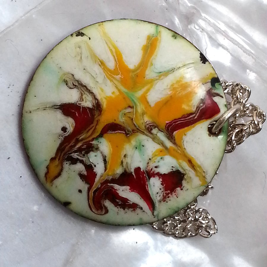 red and yellow scrolled pendant