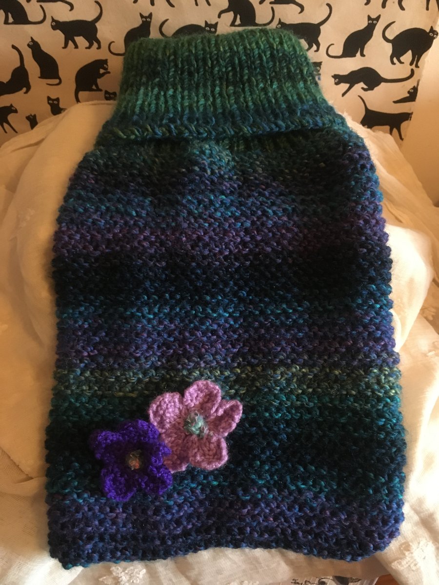 Cosy hand knitted hot water bottle cover
