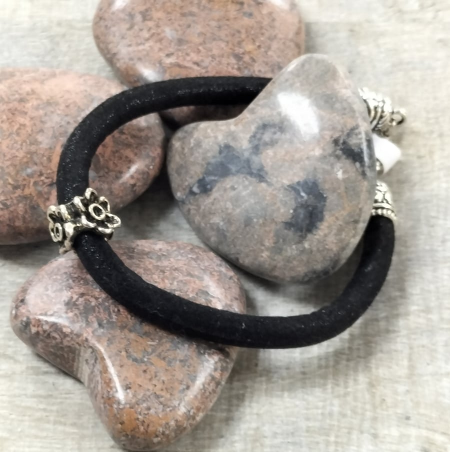 Black fabric bracelet with flower bead