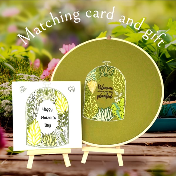 Unique hand embroidered wall hanging. Terrarium filled with gorgeous plants. 