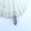 Silver-wrapped amethyst pendant