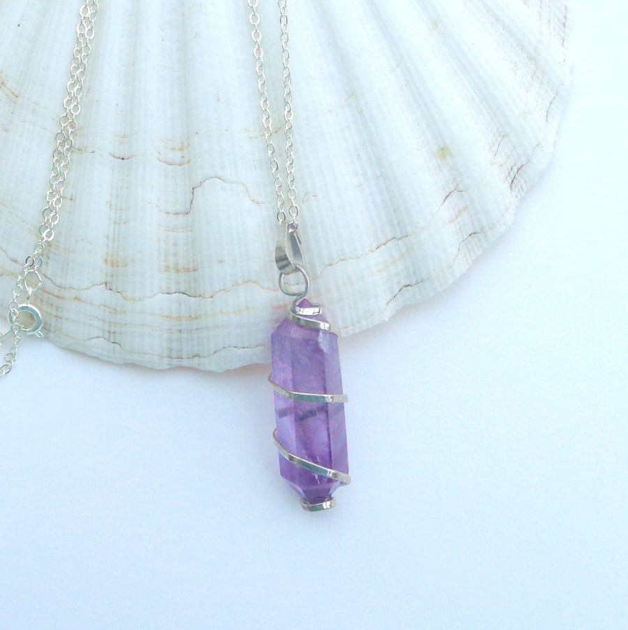 Silver-wrapped amethyst pendant