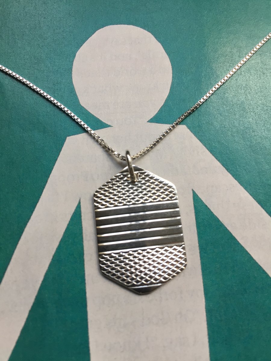6 sided silver necklace made from a 1953 Sheffield napkin ring 