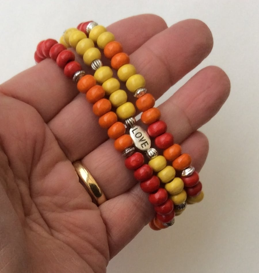 Set of 3 red, orange & yellow wooden elasticated bracelets