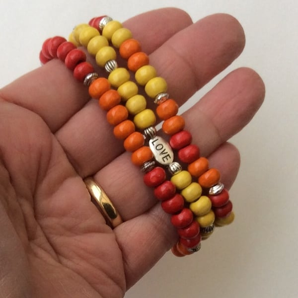 Set of 3 red, orange & yellow wooden elasticated bracelets