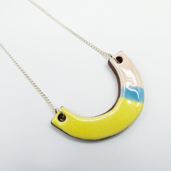 Ceramic necklace in pastel yellow, pink, and blue on silver plate curb chain.