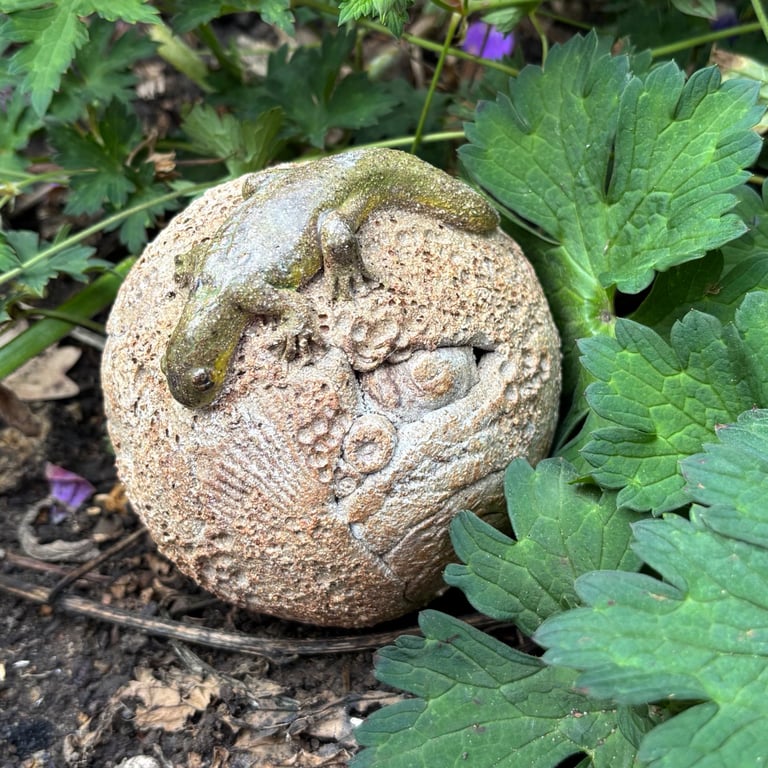 Stoneware sphere with lizard