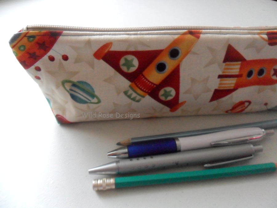  Pencil case in cute space ship fabric with free crayons.