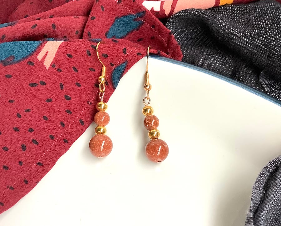 Goldstone earrings, shiny dangling, gold plated fish hooks
