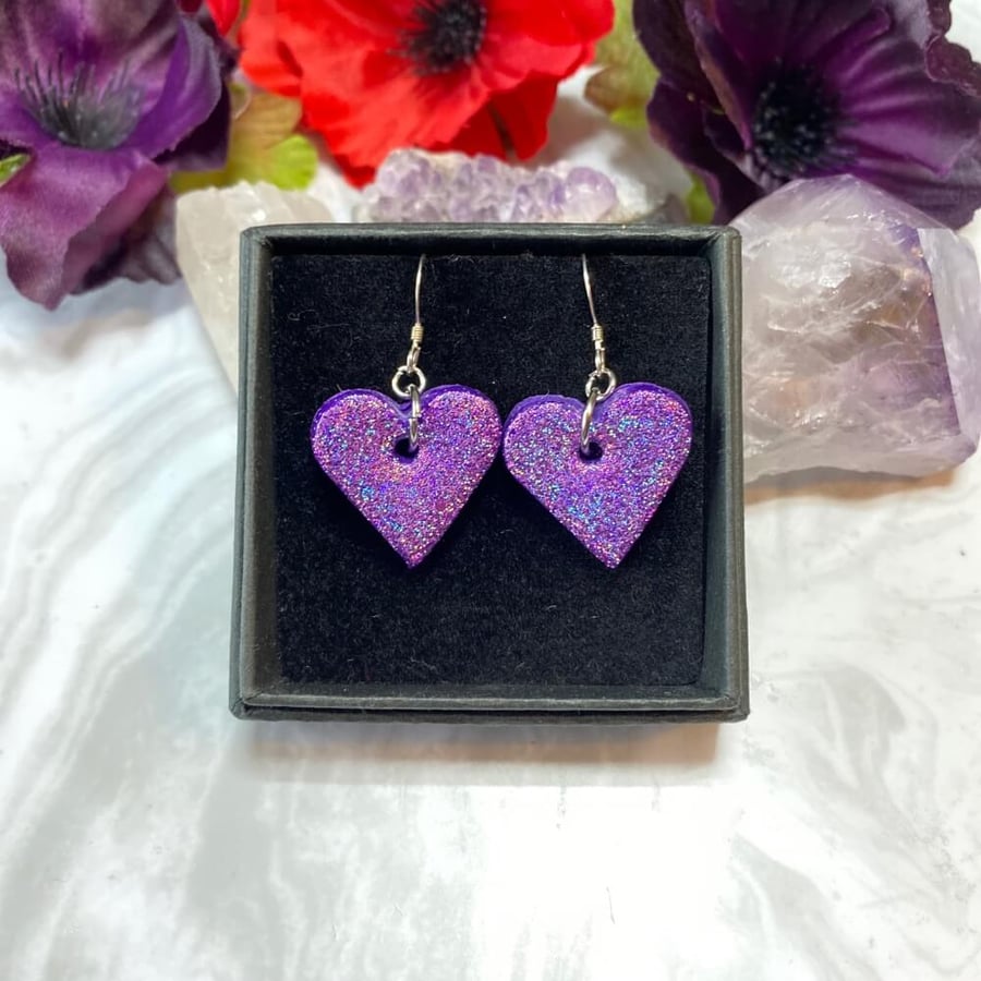 Purple heart glitter earrings on sterling silver ear wires.