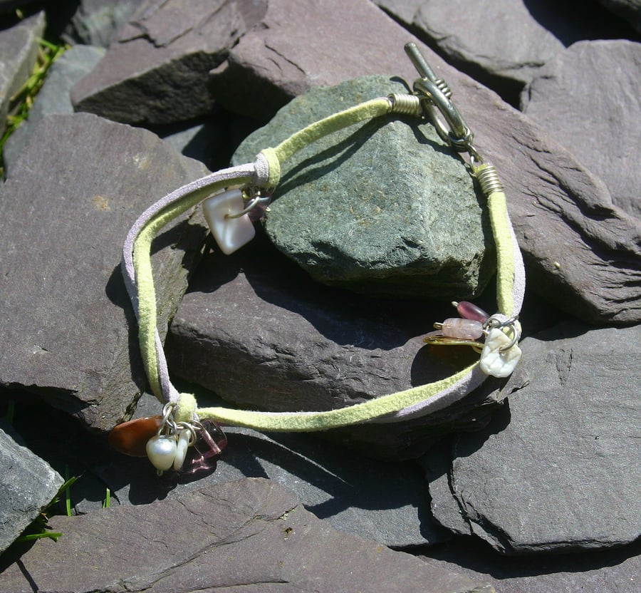 Light yellow green and lilac suede anklet with toggle clasp and charms. 