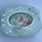 Bright and colourful bird on a branch 3D diorama card