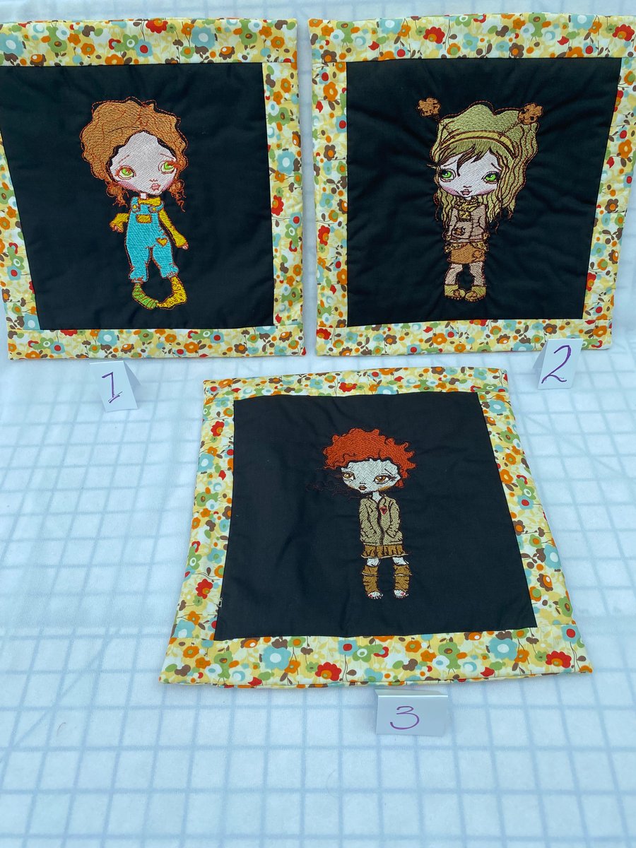 Padded Cushion Cover with an Embroidered Melancholy Girl. It’s All in the Eyes. 