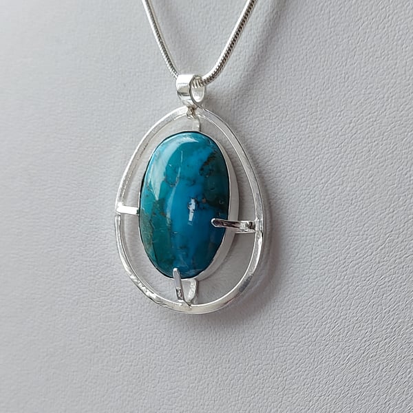Sterling silver pendant necklace with oval turquoise cabochon