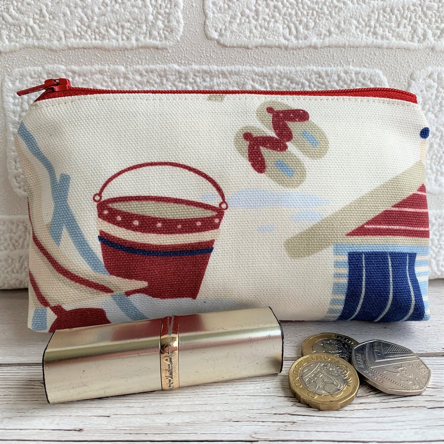 Large seaside coin purse in cream with red bucket and flip flops