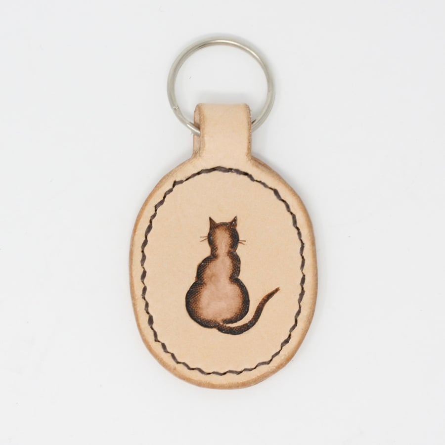 Leather key fob with hand-painted cat motif