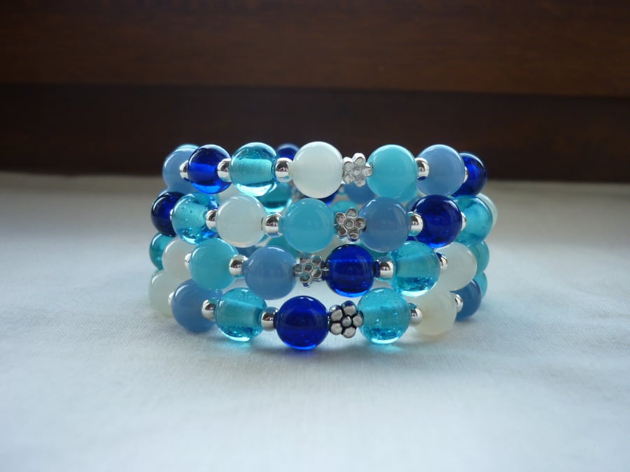 AQUA, TURQUOISE, BLUES, GREENS, WHITE AND SILVER MEMORY WIRE BRACELET.  1082
