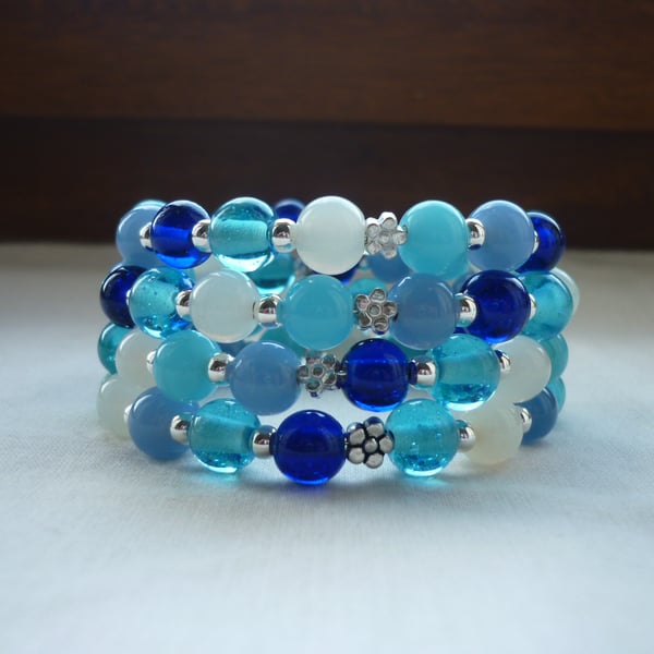 AQUA, TURQUOISE, BLUES, GREENS, WHITE AND SILVER MEMORY WIRE BRACELET.  1082