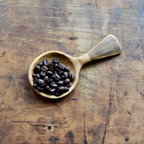 Hand carved wooden scoop spoon