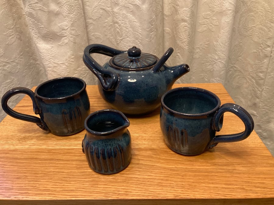 Tea for two!  Teapot, 2 mugs and pourer