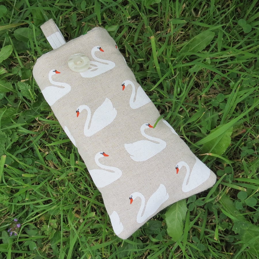 A padded glasses sleeve.  Swans design.  Sunglasses sleeve.