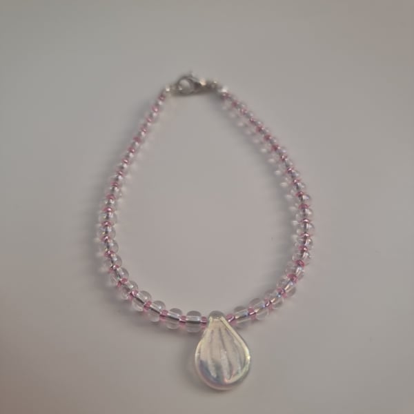 Crystal pip bead bracelet with clear crystal and rose seed beads