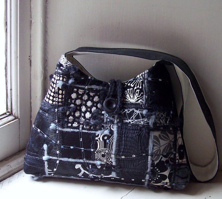 Fabric shoulder bag with mixed textiles in black and white