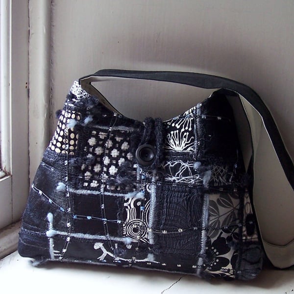 Fabric shoulder bag with mixed textiles in black and white