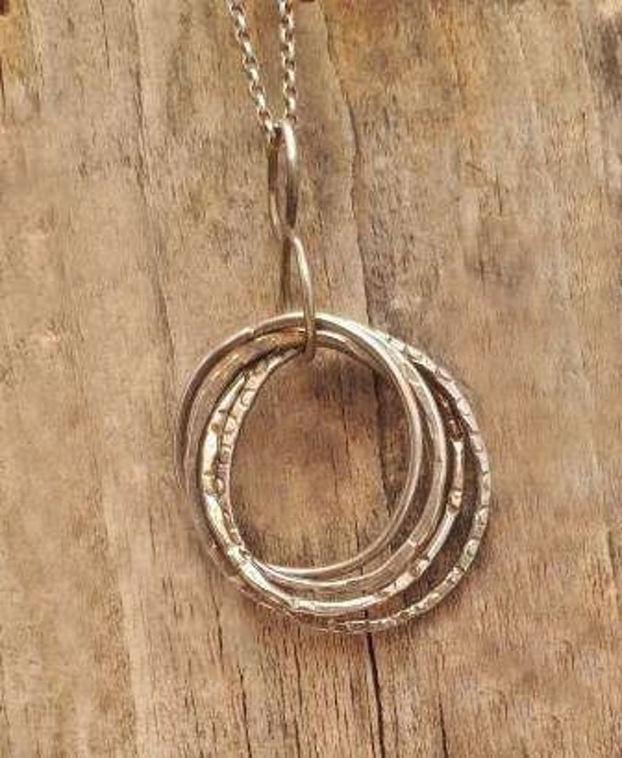Silver four textured rings Pendant