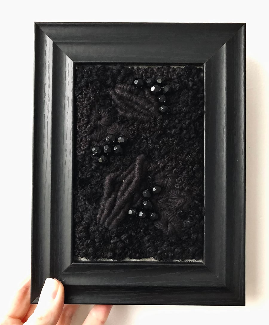 Black out a hand embroidered art piece 