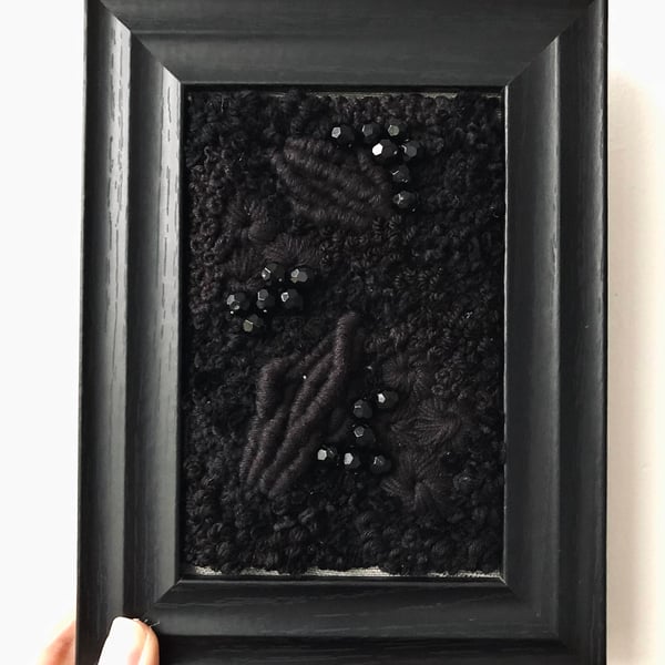 Black out a hand embroidered art piece 