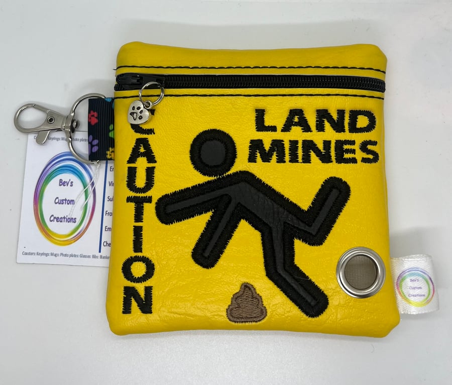 Land mines Embroidered Poo bag dispenser.