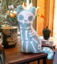 Spooky Crochet Cat Mini Cushion - Blue with white bones - Image 2